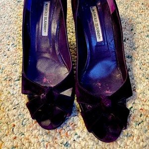 Manolo Blahnik purple suede peep toe heels.
